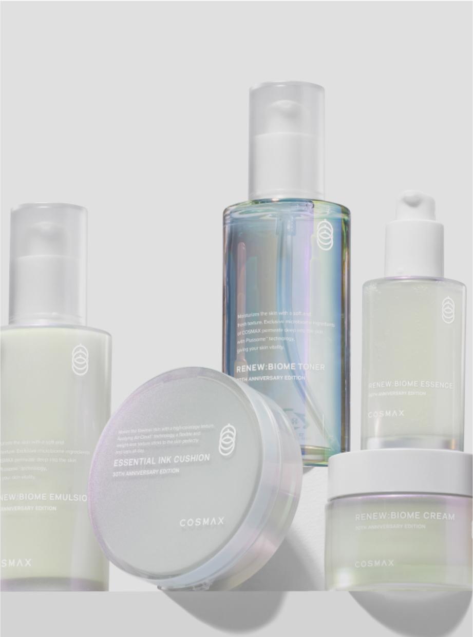 Collection of products developed by COSMAX including pump bottles with clear toner and opaque emulsion, cushion foundation compacts, and cream jars